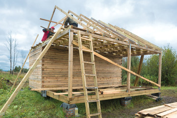 Construction of a wooden house in a rural area