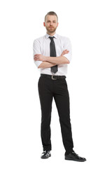 A young man with a beard in his daily shirt stands in full growth, his arms folded, isolated on a white background.