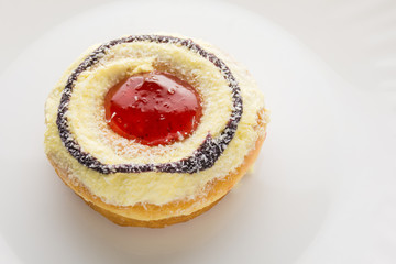 Donut on a white plate, donut with white background.