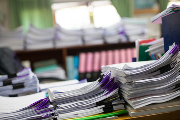 Stack of white papers sheet on office background.