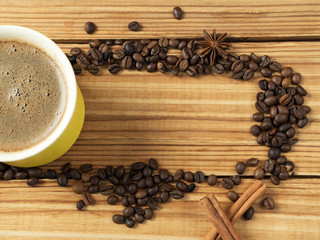 Mug of hot coffee and copyspace in the center of the coffee beans