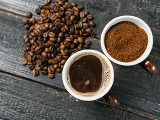 Whole roasted coffee, freshly ground coffee and brewed fragrant espresso in a Cup