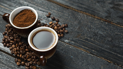 Whole roasted coffee, freshly ground coffee and brewed fragrant espresso in a Cup