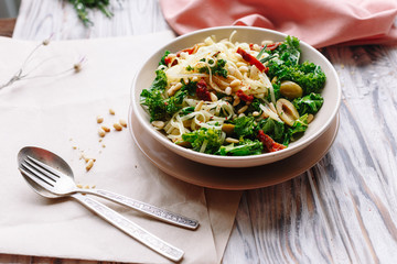 Pasta with olive, cabbage and nuts. Italian dish.