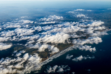 Flying above the clouds, view from the airplane, North Island, New Zealand