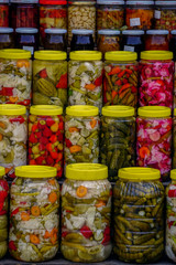 Fototapeta premium Farmers market in Bursa Turkey selling homemade pickles olive oil herbs close up view