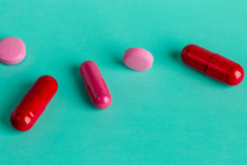 Red and pink medicinal tablets and capsules