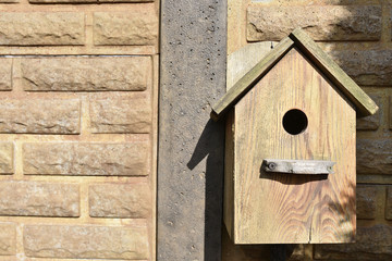 Closeup of a weathered birdhouse.