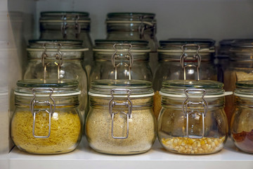 Pulses jars in the kitchen drawer arranged neatly close up view