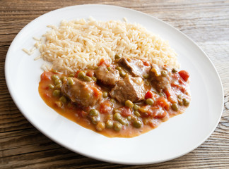 meat and vegetables stew garnished with rice