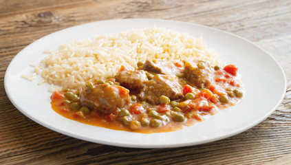 goulash garnished with rice