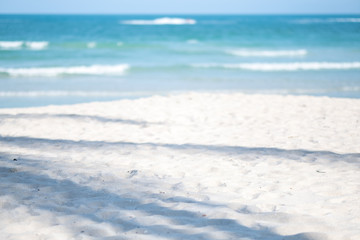 Landscape image of tropical white beach with blue sky background