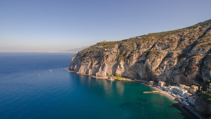 Fototapeta na wymiar View of the Sorrento coast. Meta beach, travel concept, space for text, bay with boats, Italia mountains, travel concept