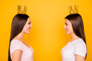Close-up profile side view portrait of nice-looking cute charming lovely sweet attractive cheerful cheery straight-haired girls isolated over bright vivid shine yellow background
