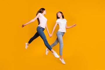 Fototapeta na wymiar Full length body size view portrait of nice-looking attractive slim fit thin feminine girlish slender cheerful straight-haired ladies having fun spare time isolated over bright vivid shine background