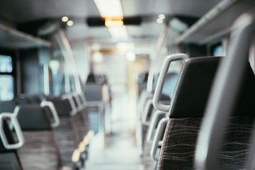Interior of a public transport train, empty seats