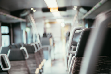 Interior of a public transport train, empty seats