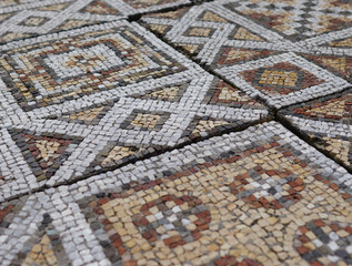 Elements of an ancient ceramic mosaic on the stone