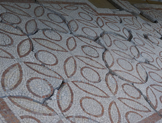 Elements of an ancient ceramic mosaic on the stone