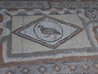 Elements of an ancient ceramic mosaic on the stone