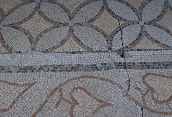 Elements of an ancient ceramic mosaic on the stone