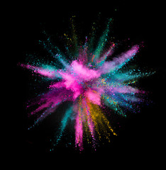 Explosion of colored powder on black background