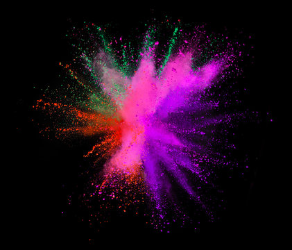 Explosion of colored powder on black background