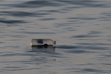 A plastic water bottle becomes water polution