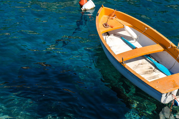 Obraz premium Fishing boat floating on the water, blue sea and sky with copyspace
