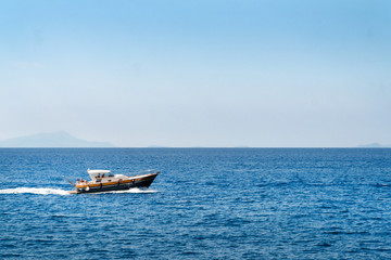 luxury boat, yaht floating on the water, blue sea and sky with copyspace, transportation relax and trip concept