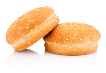 Two hamburger buns with sesame isolated on white background