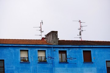 television aerial on the building rooftop in the city. Bilbao, Spain,