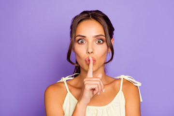 Fototapeta premium Closeup photo portrait of attractive pretty cute nice glad funny funky charming she her lady holding forefinger near closed mouth isolated vibrant background