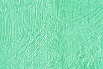 Background color green. Wall painted in green texture.
