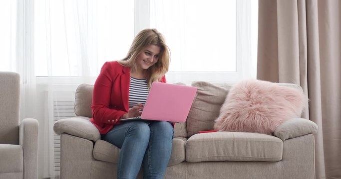 Woman working on laptop at home