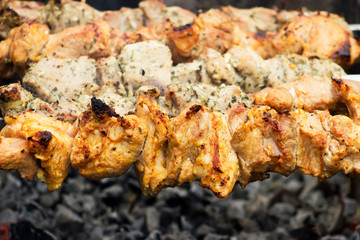 Freshly marinated shashlik prepared for roasting on charcoal. The traditional dish is made outdoors