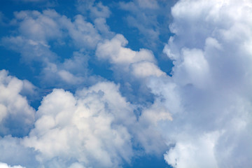 white fluffy clouds on blue sky