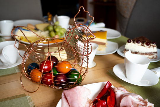 Chicken hen basket made of copper wire containing colored easter eggs - Powered by Adobe
