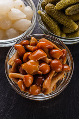 pickled vegetables on a dark stone background