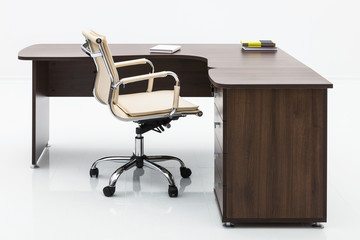 wood table and leather armchair