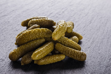 pickled vegetables on a dark stone background