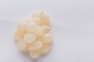 pickled vegetables on a white acrylic background