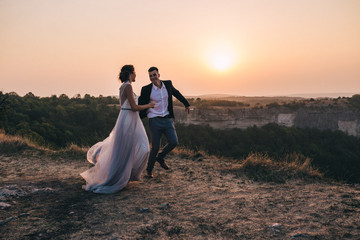 bride and groom in Crimea mountains at sunset