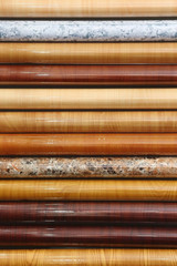 Material for decor. Self-adhesive film with different designs in rolls on the shop window for sale