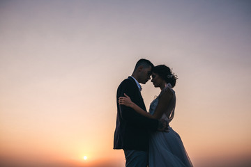 couple kissing at sunset in Crimea mountains on sunset