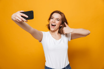 Portrait of a happy lovely girl standing isolated