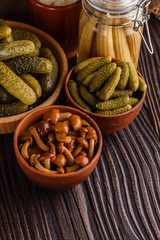 pickled vegetables on a wooden rustic background