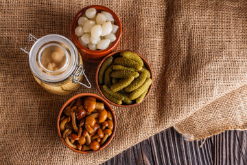 pickled vegetables on a wooden rustic background