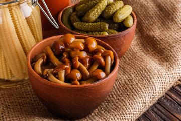 pickled vegetables on a wooden rustic background