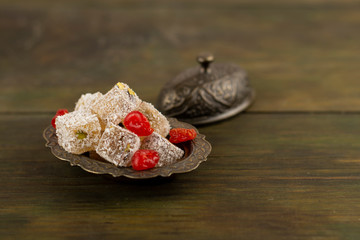 Oriental sweets on a wooden background